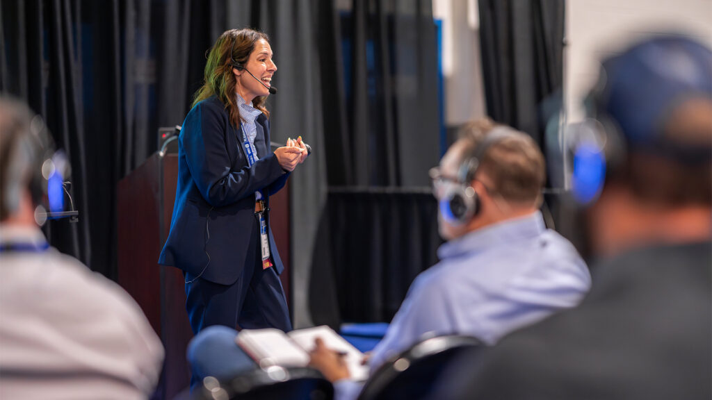 Speaker presenting to a seated audience